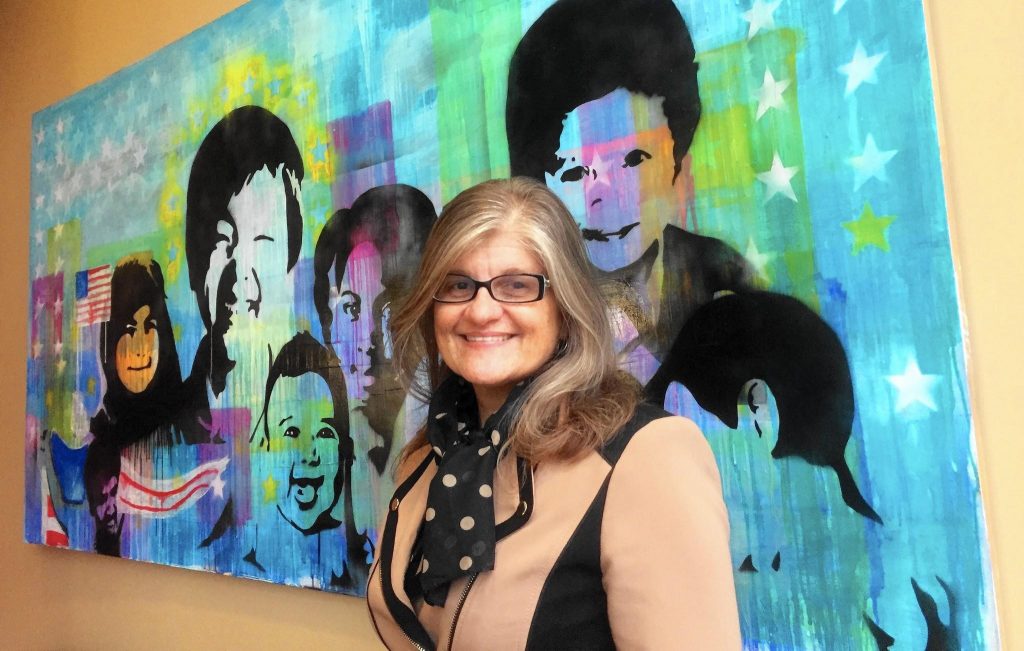 Shirley Sadjadi in front of mural